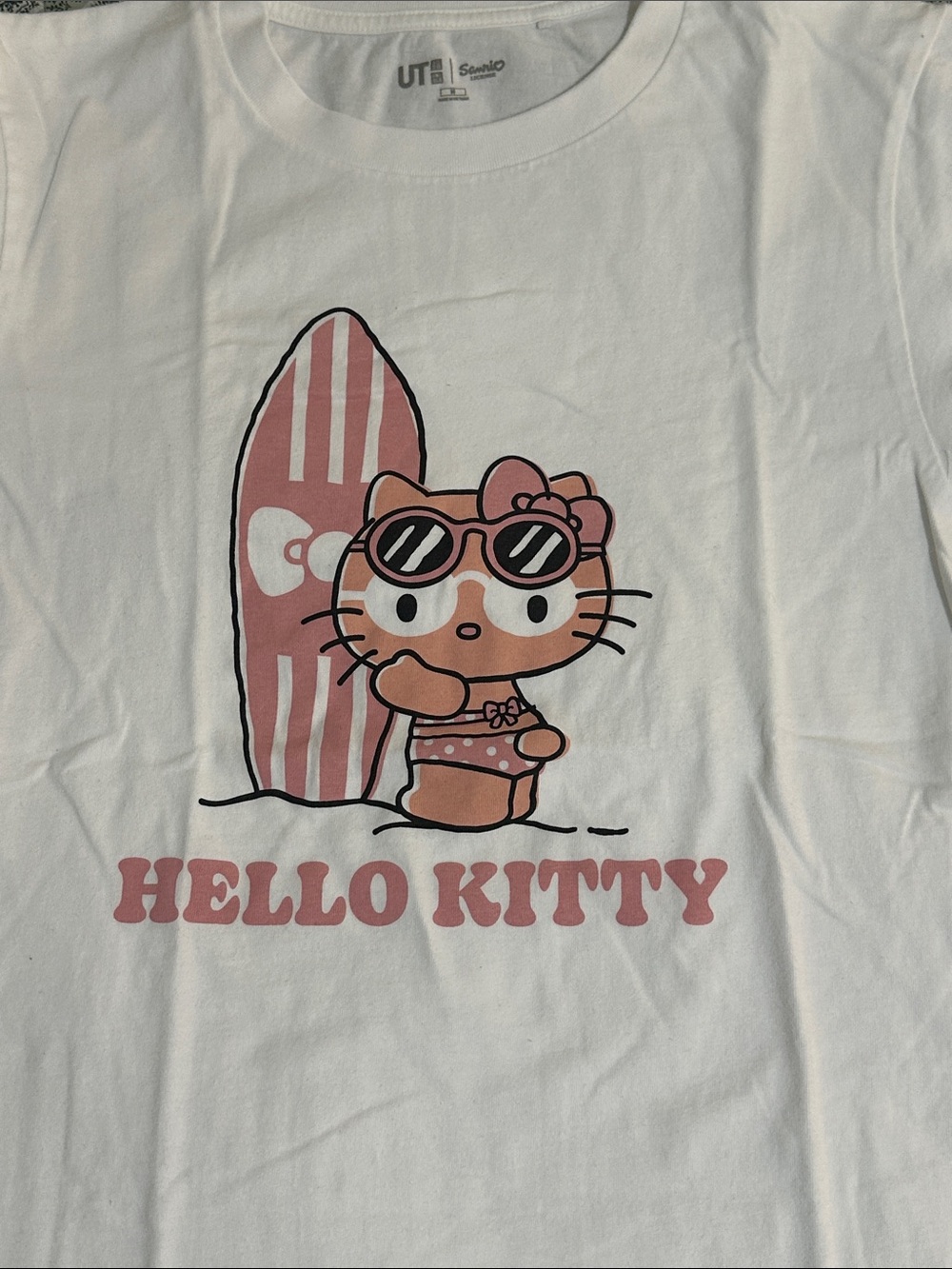 Uniqlo White Hello Kitty Tee with Pink Surf Graphic - Picture 2 of 2